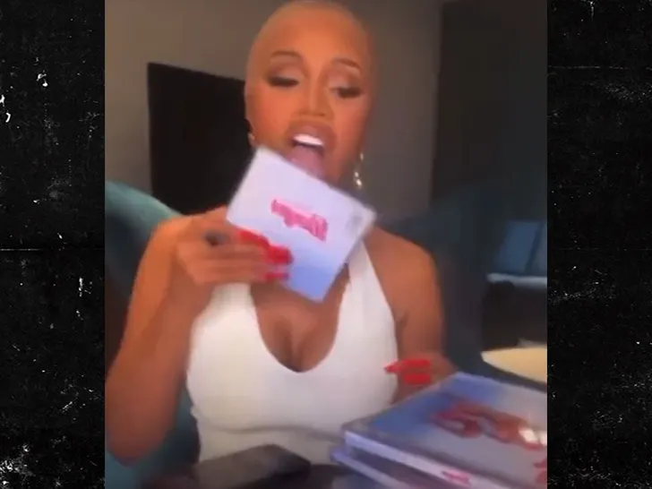 Cardi B Licks CDs for Fans